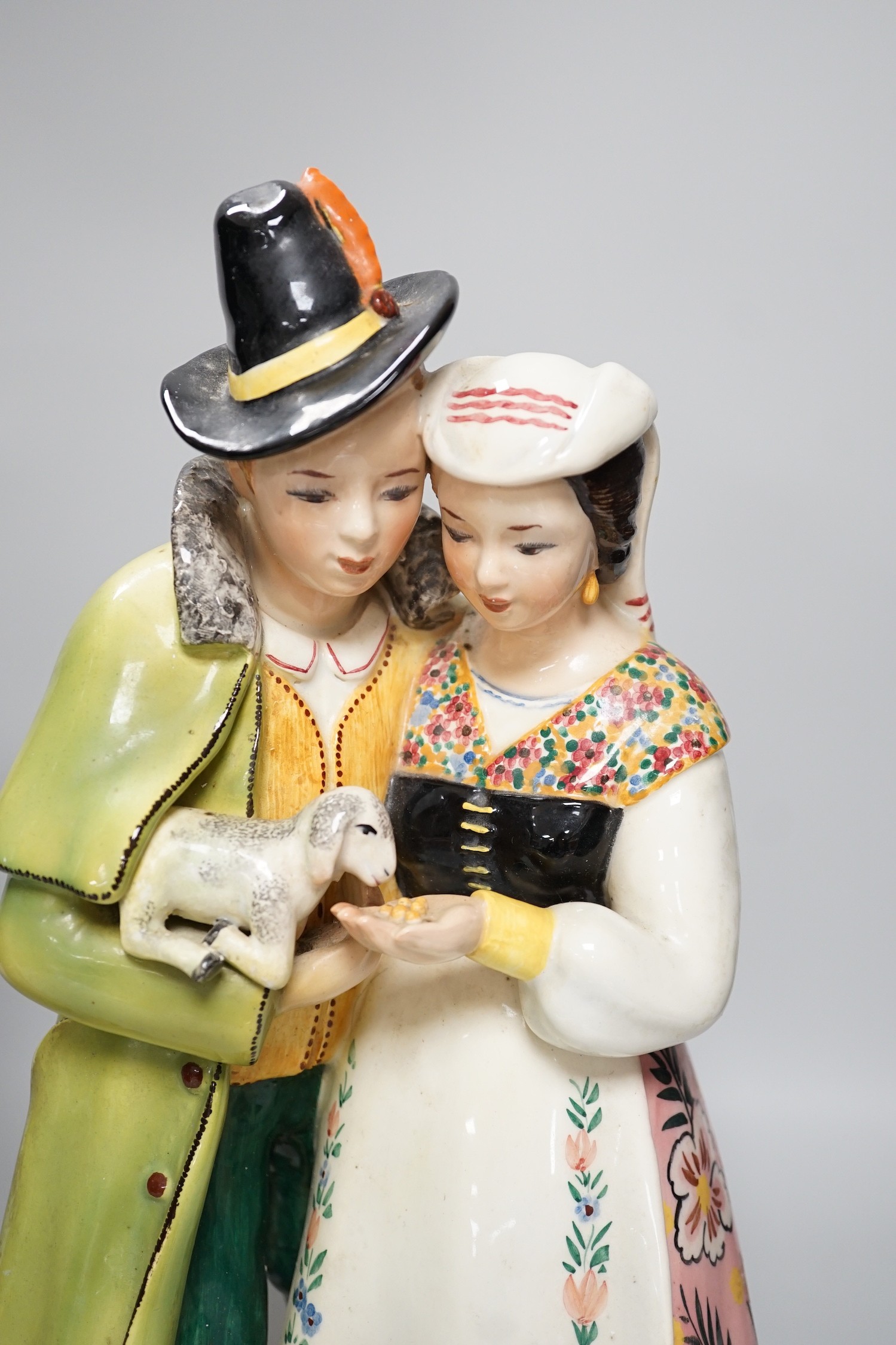 A Chinese porcelain figure of a lady together with a continental porcelain figure group, tallest 38cm